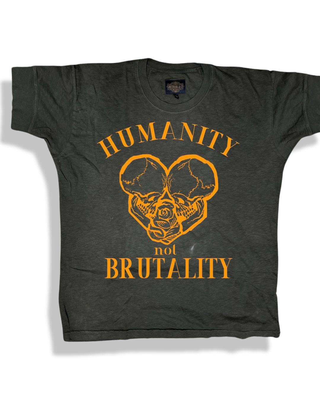 Humanity not Brutality Skull Heart Graphic Statement Tee Sheehan&Co - Sheehan and Co.